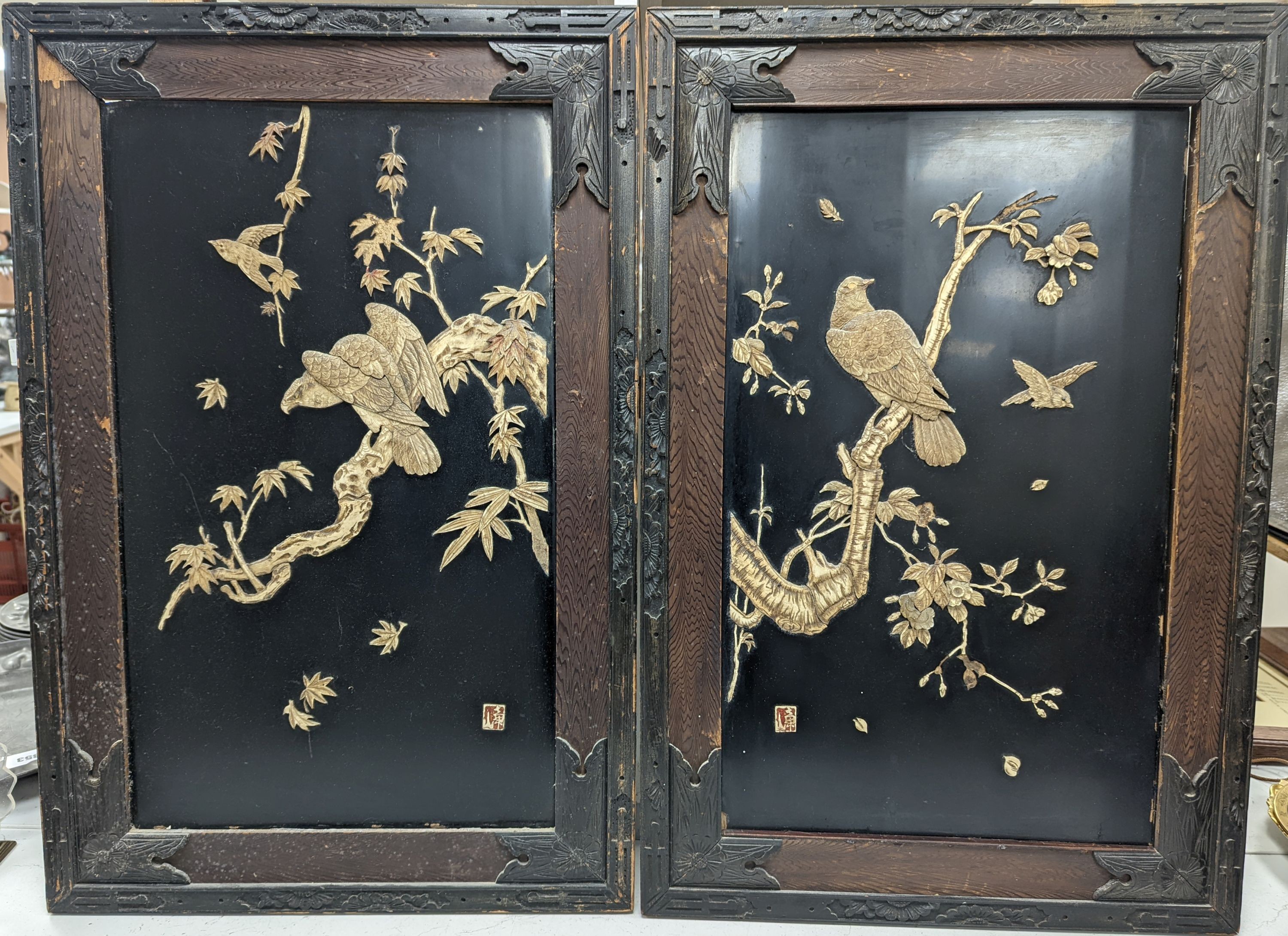 A pair of Japanese carved bone lacquer ground rectangular plaques, height 74cm